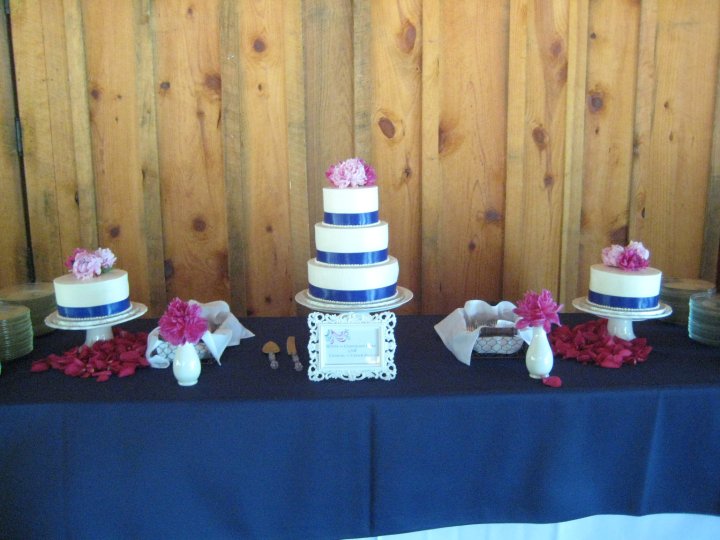  a white pedestal and they were decorated with ribbon and real flowers