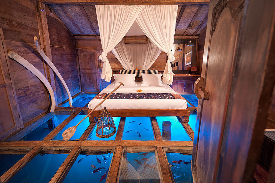  14 Crazy Hotels That Will Give You Serious Travel Goals - Glass Floor Udang House in Bali, Indonesia boasts incredible floors to the water, plus luxurious furniture for travelers to rest their weary heads.