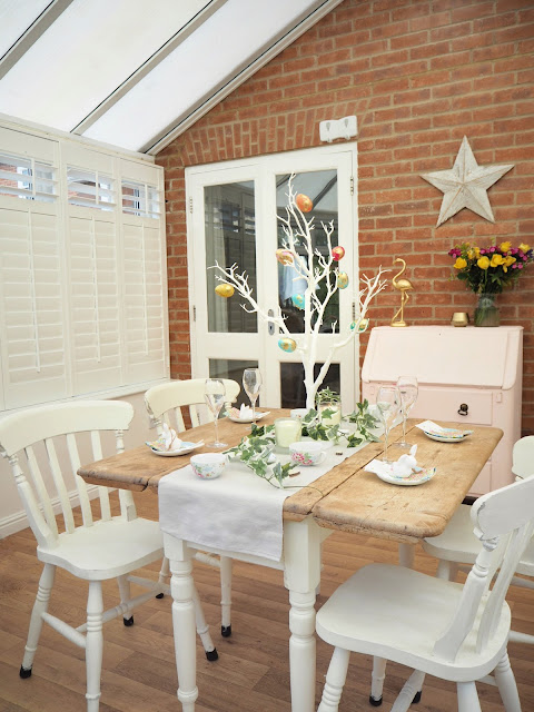 How to decorate a small dining room table and chairs for easter using decorative twig tree, plastic marble effect eggs, artificial ivy and mini eggs in teacups