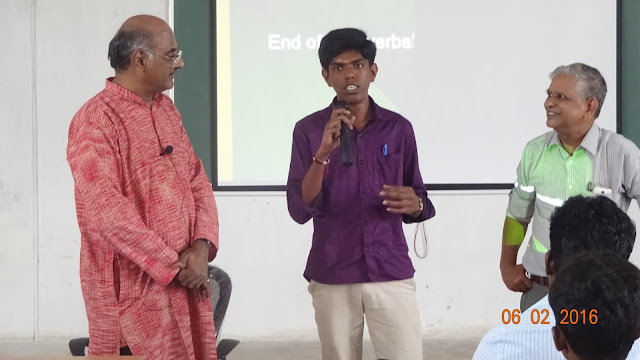 Prime Point Srinivasan (extreme left) and Dr R Jagannathan (extreme right) helping a student to make a good presentation