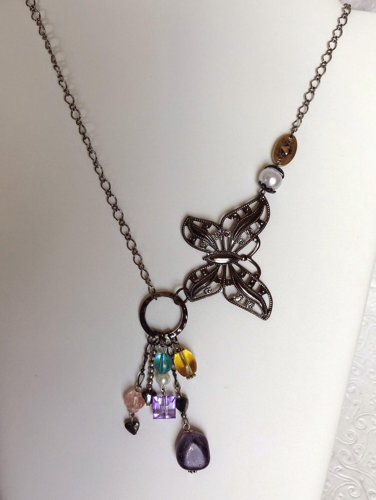 https://www.etsy.com/listing/205326993/black-nickel-butterfly-with-dangles?ref=listing-shop-header-0