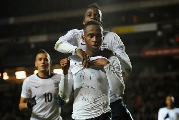 Saido Berahino lifts his shirt to reveal a tribute to his deceased father