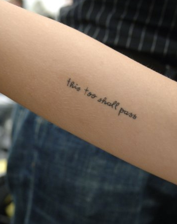 39This too shall pass' on her inside right upper arm