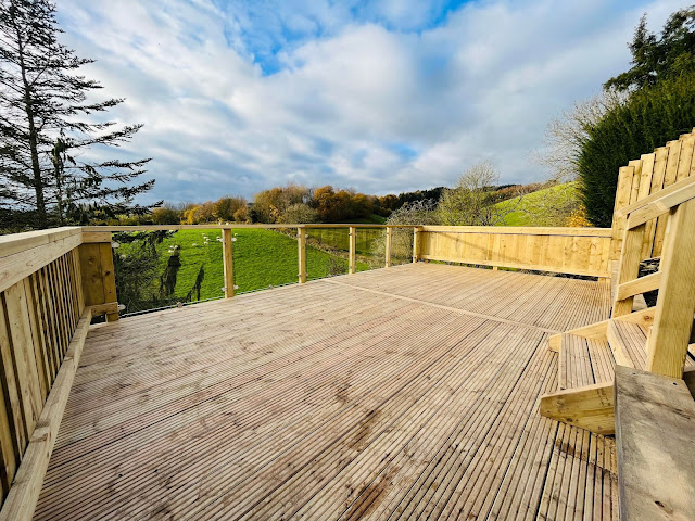 timber decking with glass panel rail