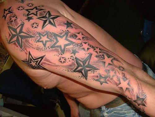 Nautical shooting star tattoo from shoulder to sleeve