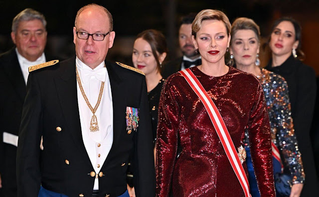 Princess Charlene wore a sequins stretch sheath long gown by Akris. Princess Caroline wore a blue skirt and sequin top by Chanel