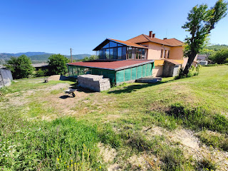 A view of the house with the lawn nicely mowed