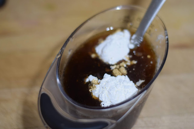 The water, soy sauce, maple syrup, sesame oil, ginger, and cornstarch in a small bowl.  