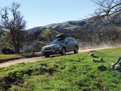 2018 Subaru Outback front three quarter carrying luggage