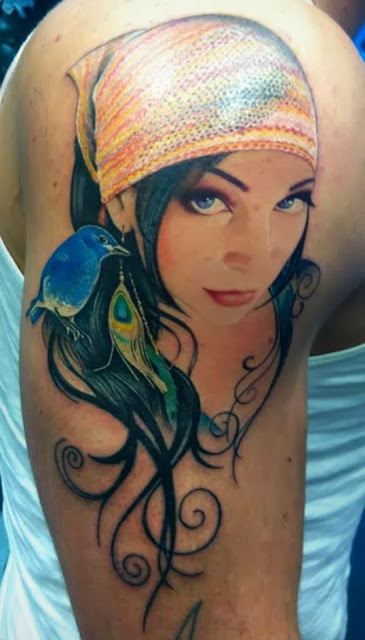 3D women face body tattoo on the right arm 