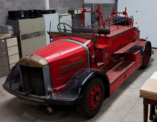 A bright red old fire engine inside the Museum Store