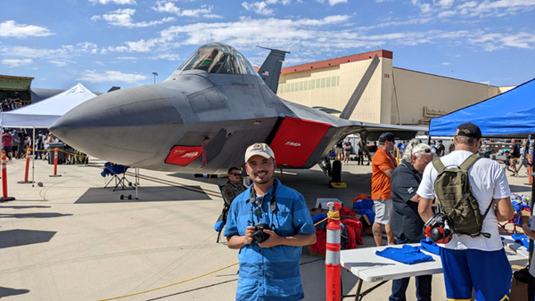 Posing with an F-22 Raptor during the Aerospace Valley Air Show at Edwards Air Force Base, CA...on October 15, 2022.