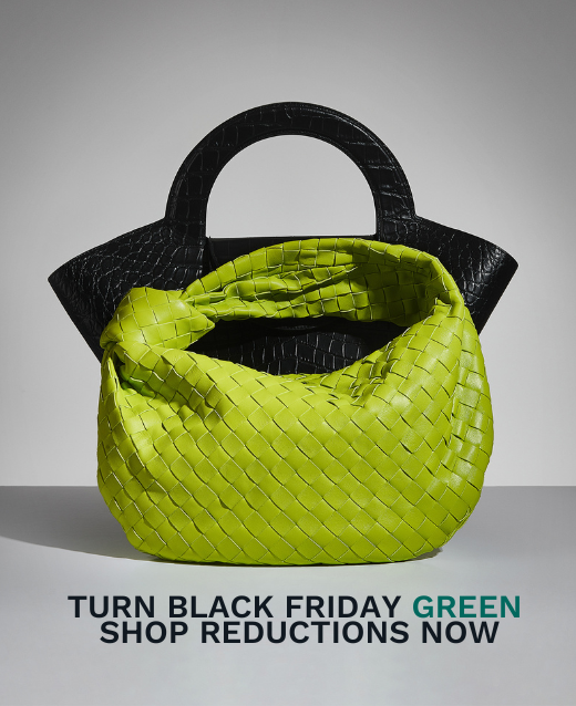 Image of black bag with a green bottega infront with text below saying Turn Black Friday Green Shop Reductions Now