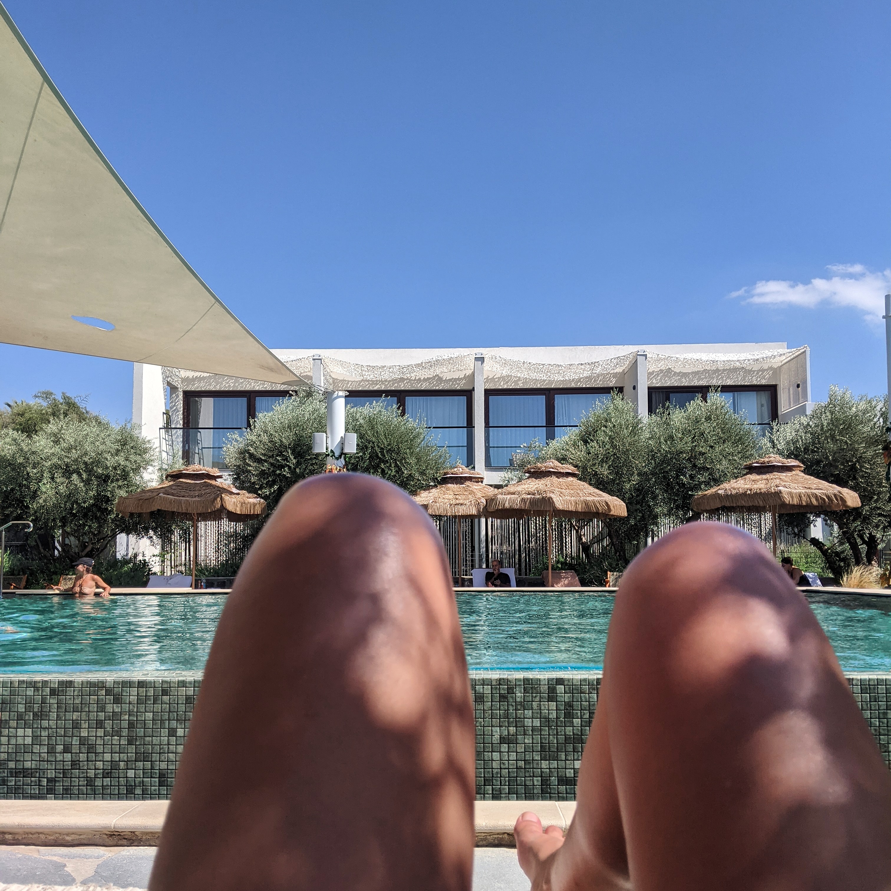 sitting by the pool at pereh hotel in israel