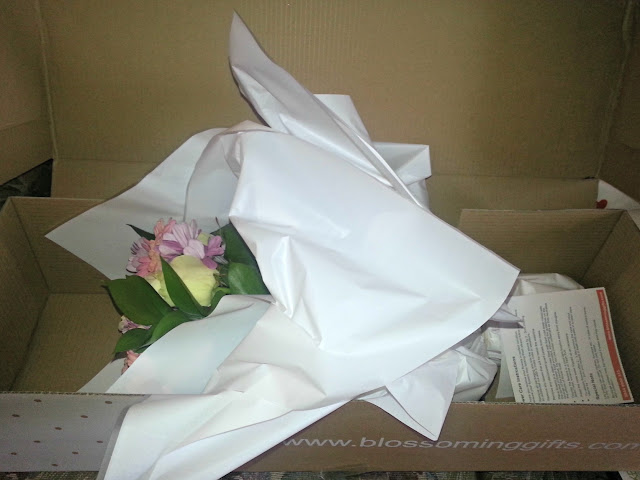 Blossoming Gifts bouquet in packaging