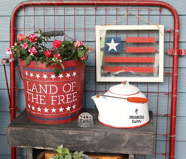 Photo of an upcycled bucket patriotic planter.