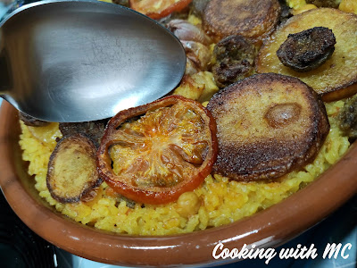 Serving arroz al horno (Spanish oven cooked rice)