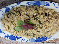 Steamed couscous with spinach leaves and grated coconut