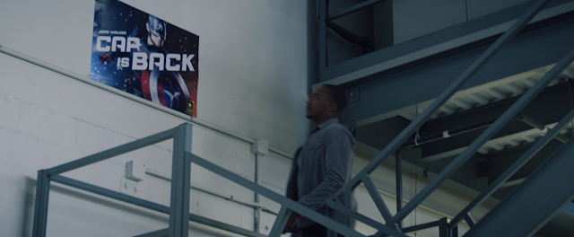 Sam Wilson Looks at Cap Is Back Propaganda Poster The Falcon and The Winter Soldier Marvel Disney Plus