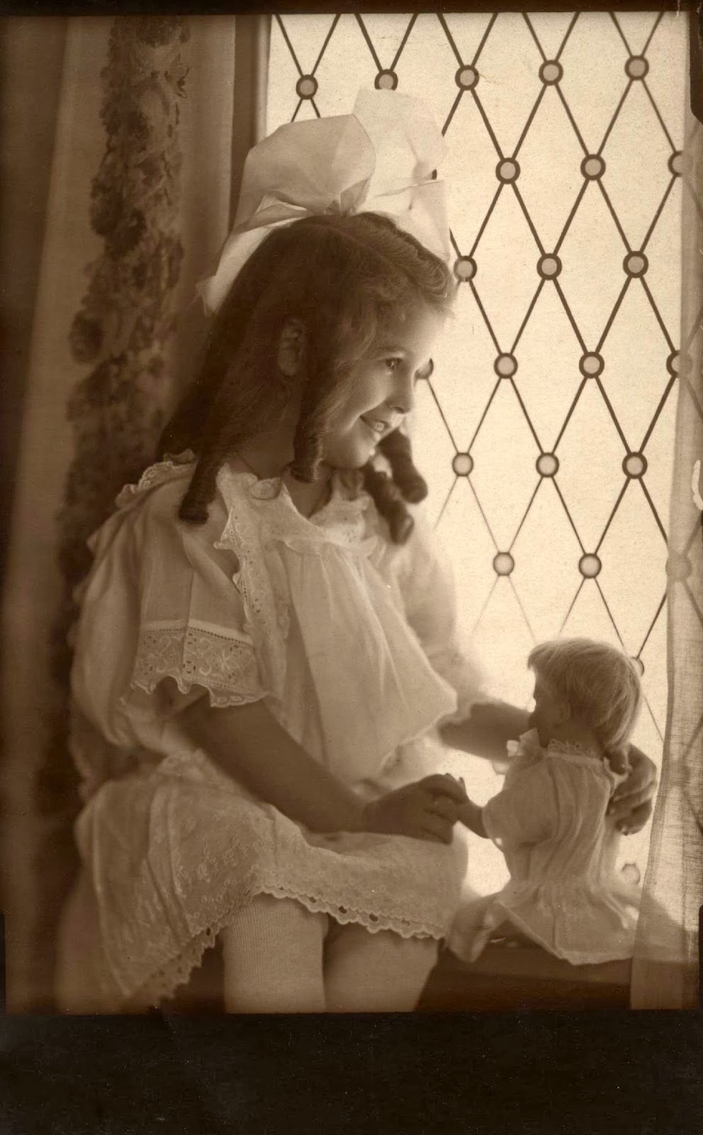 Darling little girl with her favorite dolly!