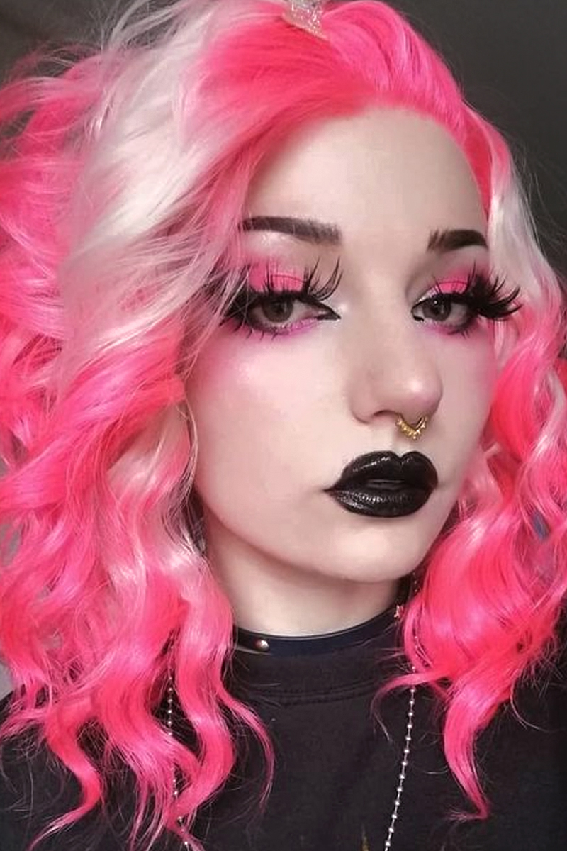 goth woman with curly pink hair and Neon Pink Gothic Eye Look with Long Lashes