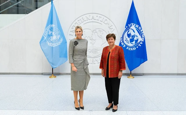 Queen Maxima wore a plaid check ruffled midi dress by Natan. International Monetary Fund Managing Director Kristalina Georgieva