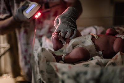 Nurse scanning Newborns Tags - Morning Owl Fine Art Birth Photography San Diego