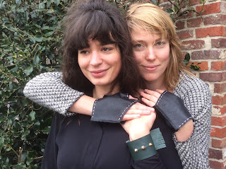 Lovelea's navy mittens and green studded, fringed bracelet.