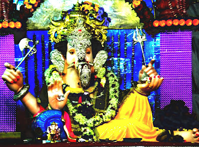 Image of Lord Ganesha sitting in a relaxed and peaceful posture, symbolizing tranquility and divine serenity