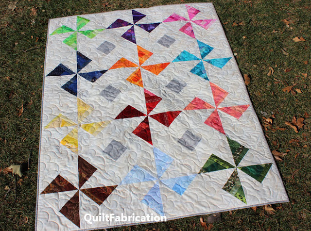 colorful pinwheel quilt by QuiltFabrication