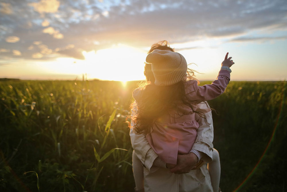 Mom and Child looking at sunset