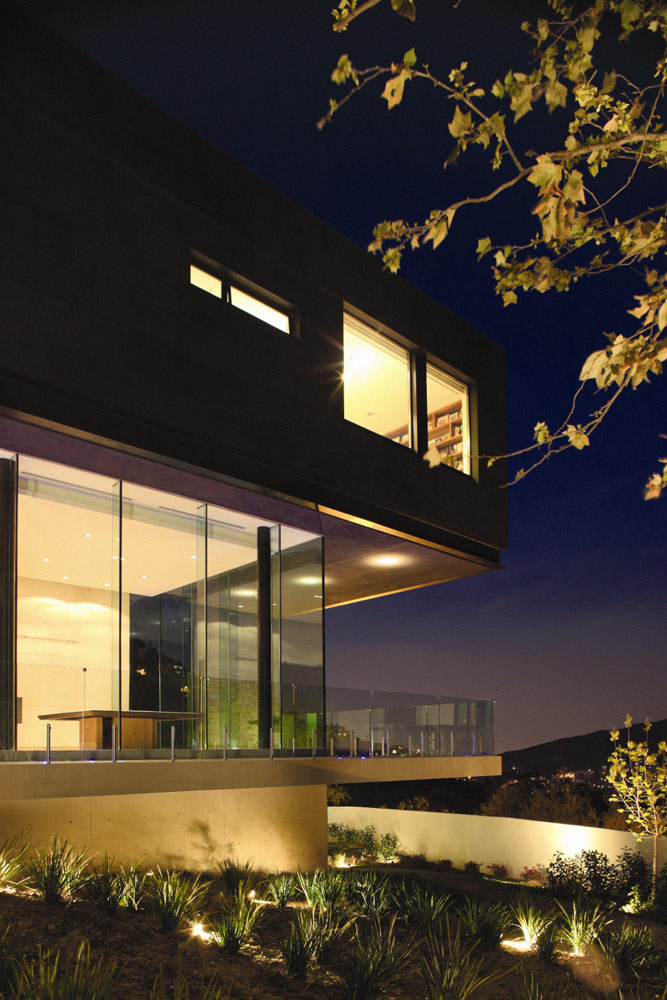 Facade of Modern contemporary CT House in Mexico at night 