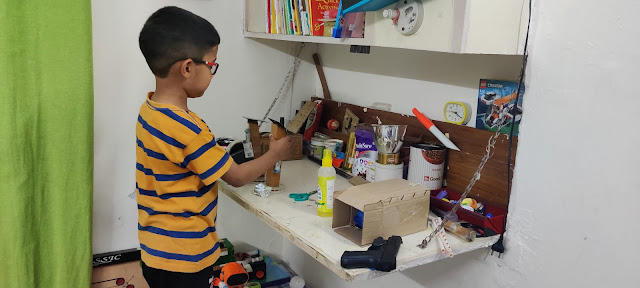 Boy making science toys in his homeschool