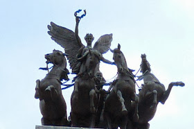 A black angel riding four black horses