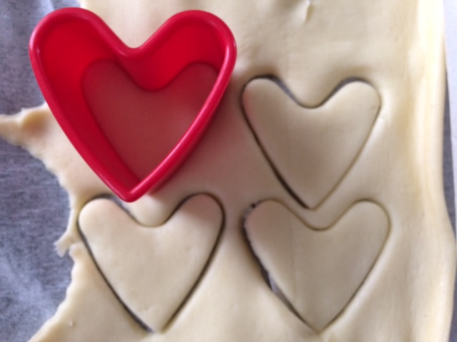 Heart cutter cutting pastry