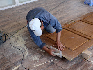 Shaving down the door so it works with the tiles