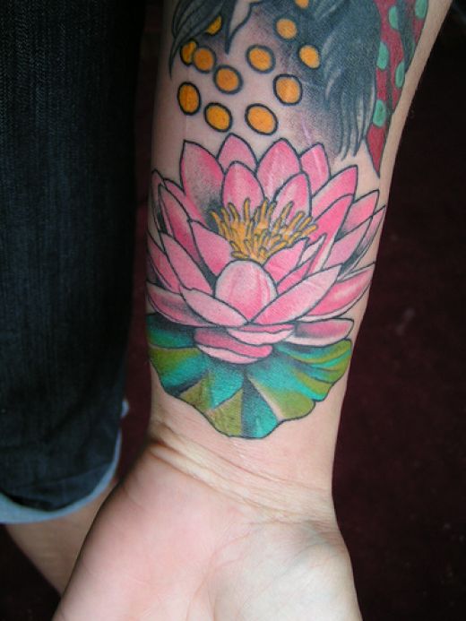 flowers tattoos on wrist. Lotus Flowers Tattoos.