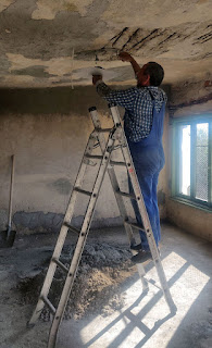 Bekir filling in more of the ceiling damage