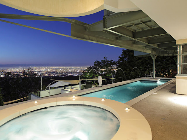 Photo of large terrace with hot tub and long pool