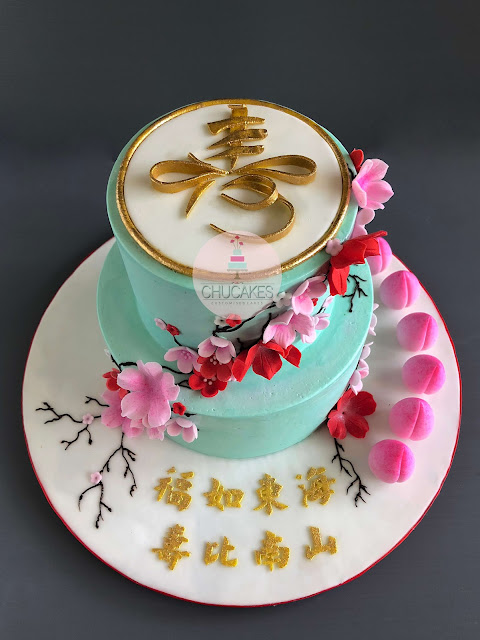 Longevity Cake with Longevity buns in buttercream with fondant flowers by chucakes