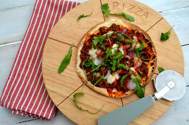 tortillas used as pizza bases topped with spicy beef, veg and cheeses