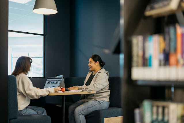 Two students enjoying a study space