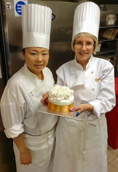 Cherish Finden and me holding a cake.