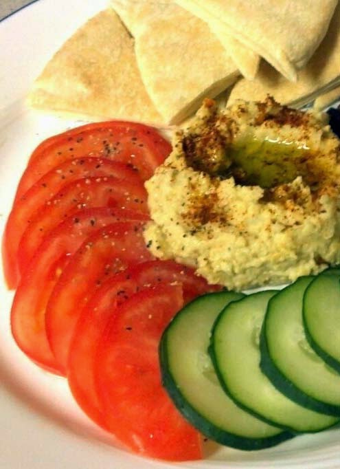 Vegetarian Snacks and Appetizers w/ Sliced Tomatoes, Cucumbers, and Warm Pita Bread Dipped in Homemade Hummus (Click for Recipe)