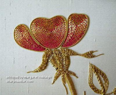 Detail of goldwork rose petals. Petals are couched with red coloured thread.