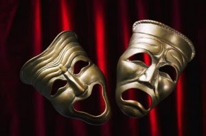 Bronze drama masks showing comedy and tragedy