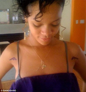 rihanna tattoos and meanings. rihanna tattoos arabic.