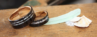 Blackwood rings with Bethlehem Olive wood interiors and inlaid with crushed shell and sea glass.