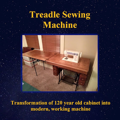 An old treadle sewing machine cabinet updated to hold a modern-made non-electric sewing machine. The entire image is framed by a blue night sky backdrop.