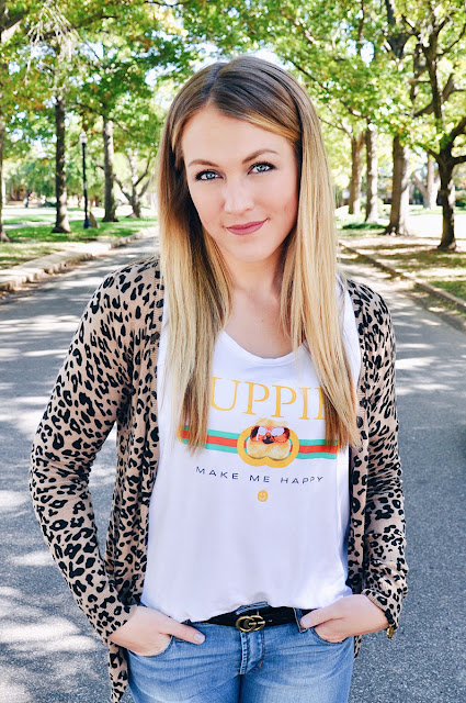 Girl wearing Leopard Cardigan and Puppy Tee on a tree lined street